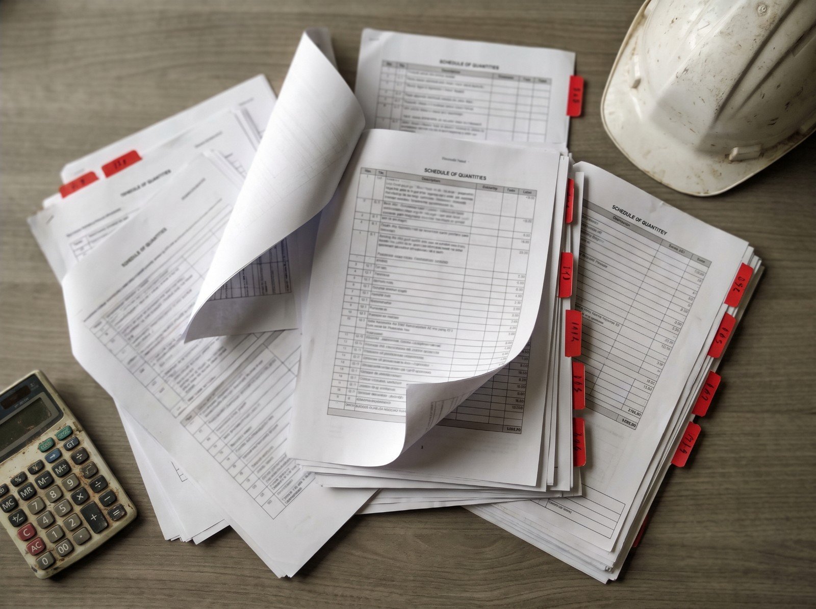 Schedule of quantities documents with hard hat